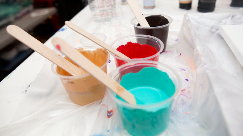 Mixing paint in small cups