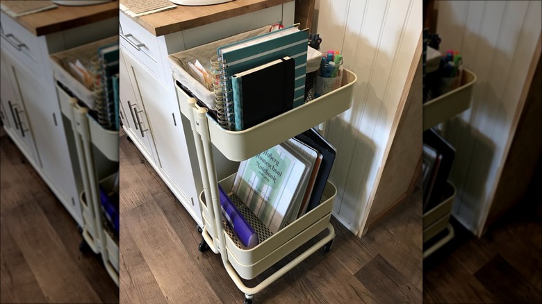 tan cart with notebooks