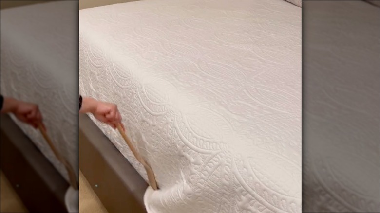 tucking in bedsheets with spatula