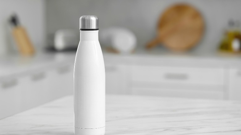 white metal bottle in kitchen