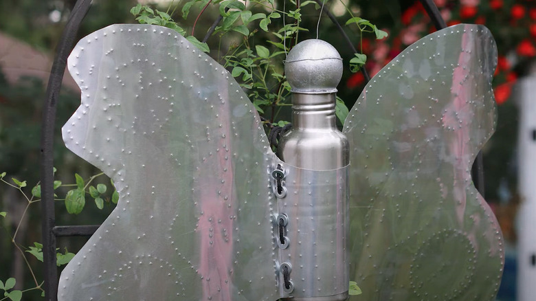 metal garden decor using bottle