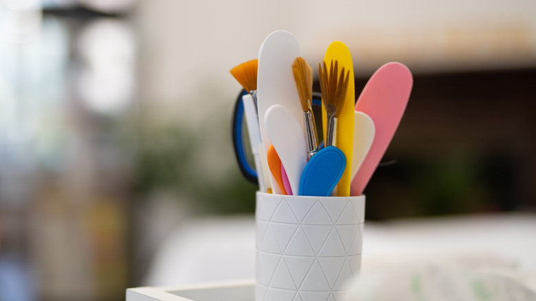 Makeup brushes in a cup