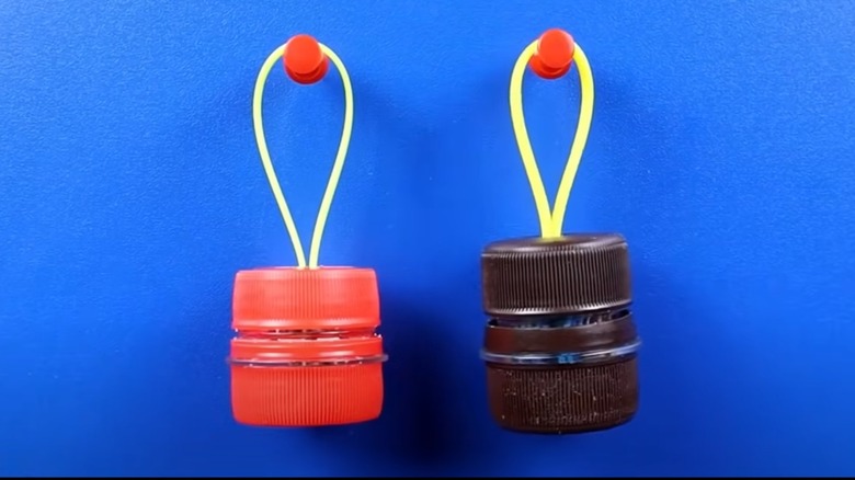 Mini storage holder made from zip ties and plastic bottle tops