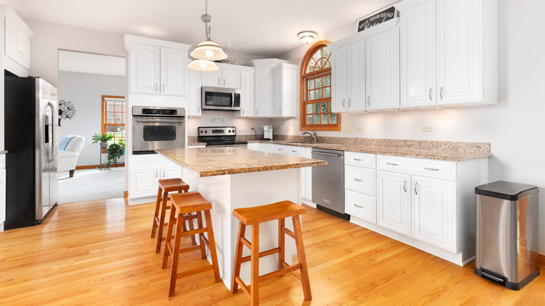 wooden stools in white kitchen