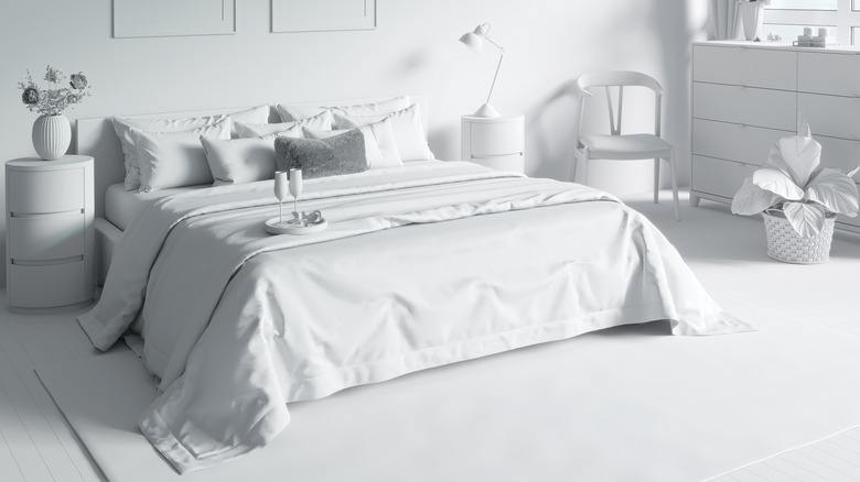 white gray bedroom with tray on bed