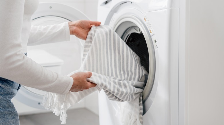 Putting towel in washing machine