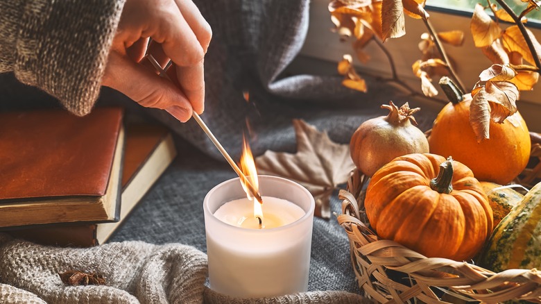 Woman lighting candle 