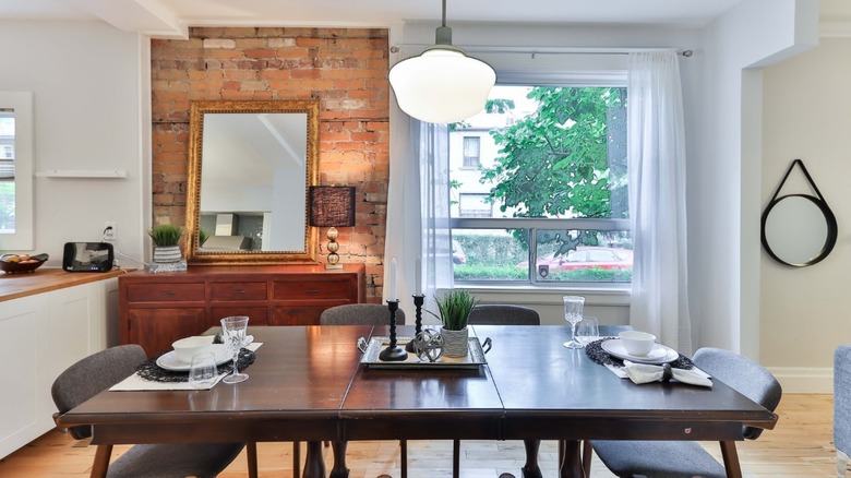 Dining room with brick wall