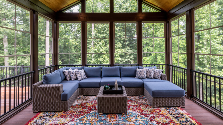 screened in porch with rug