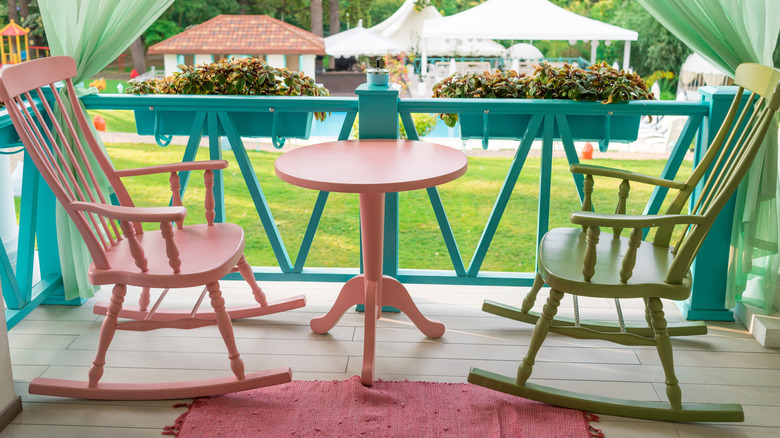 colorful porch chairs and railing