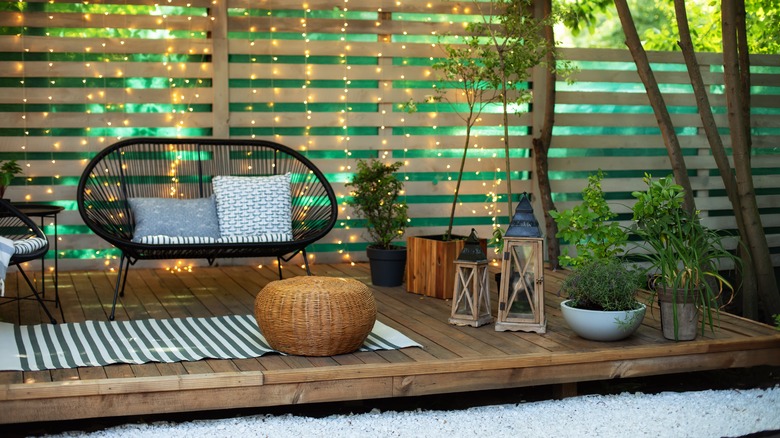 lanterns and chairs on a porch