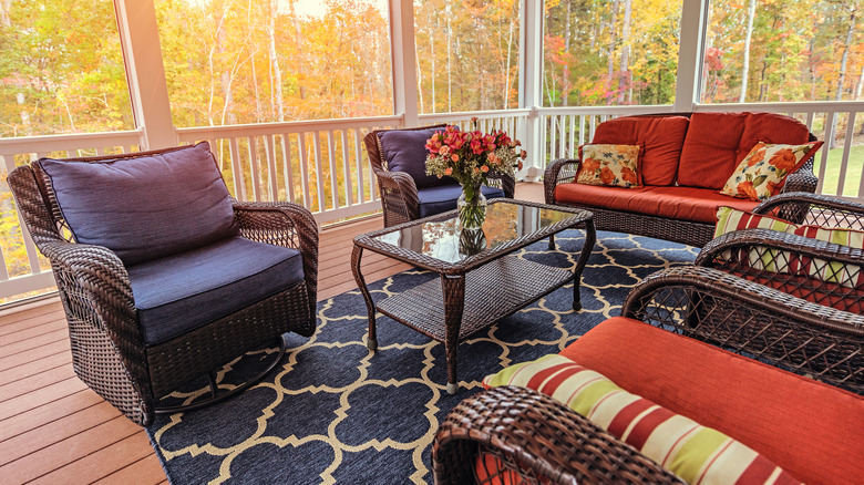 wicker furniture set on porch