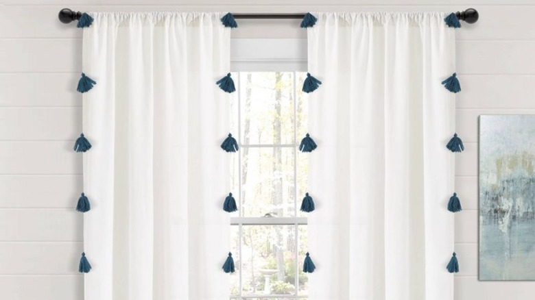 white curtains with blue tassels