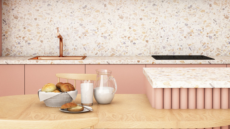 copper sink in pink kitchen