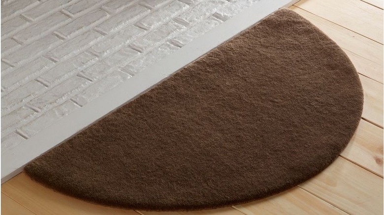 brown wool crescent hearth rug