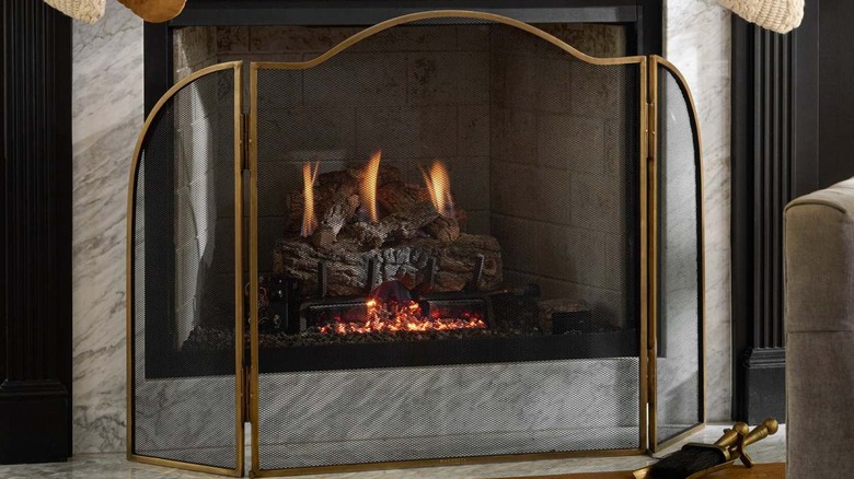 tri-fold fireplace screen and fire