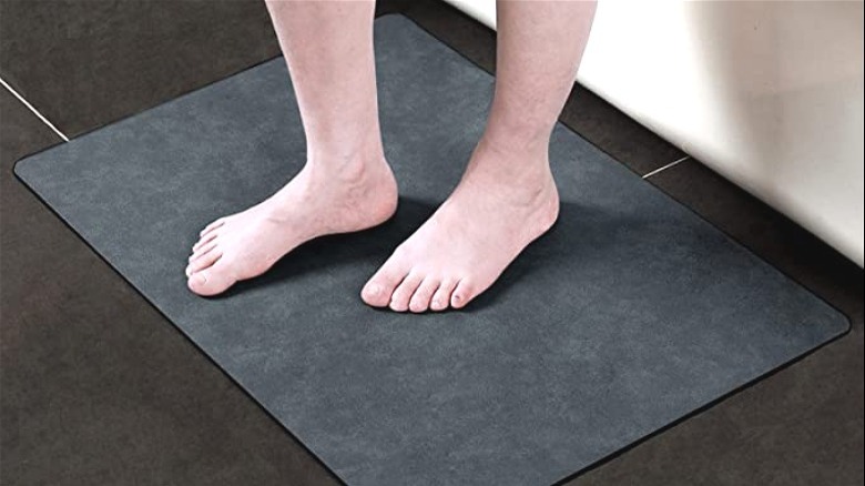 person on floor mat