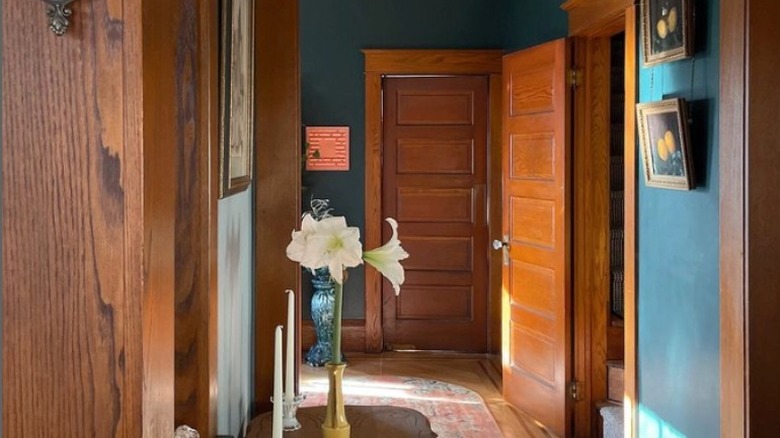 Wood trim teal hallway