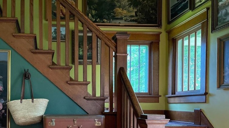 Wood staircase with green wall