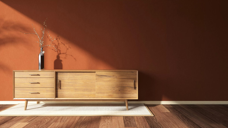 Rust orange wall with buffet