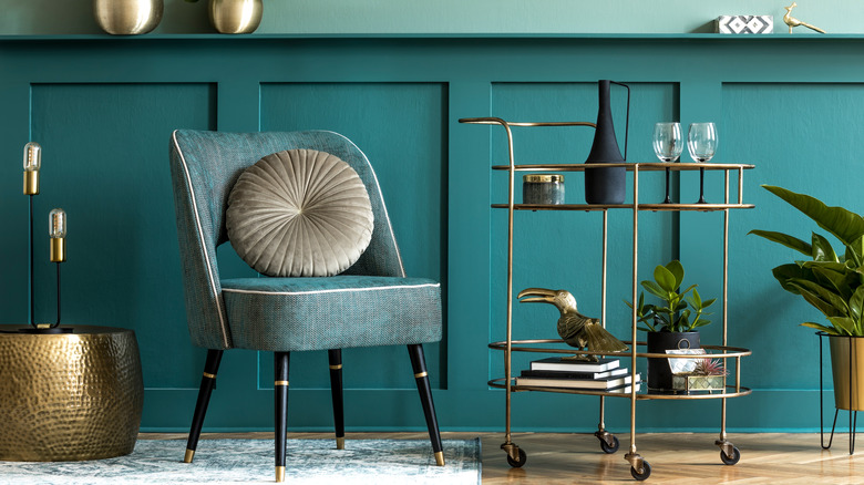 Teal panelling with bar cart