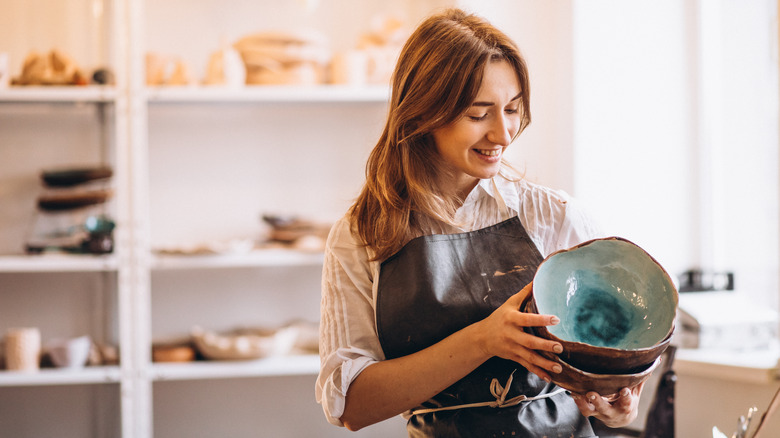 Woman holding pottery