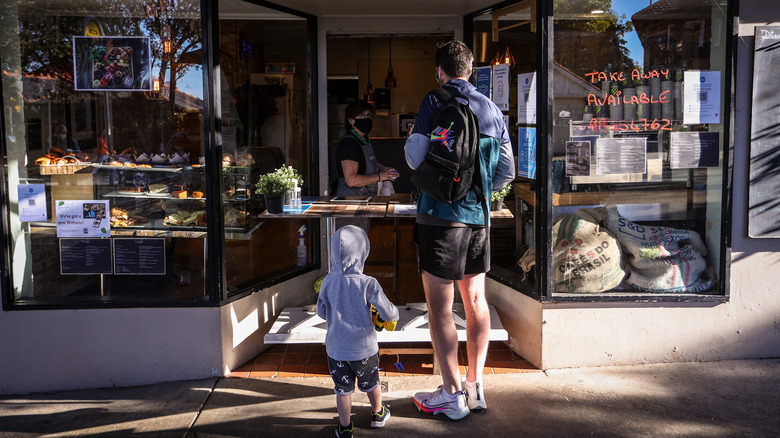 Family visiting small business