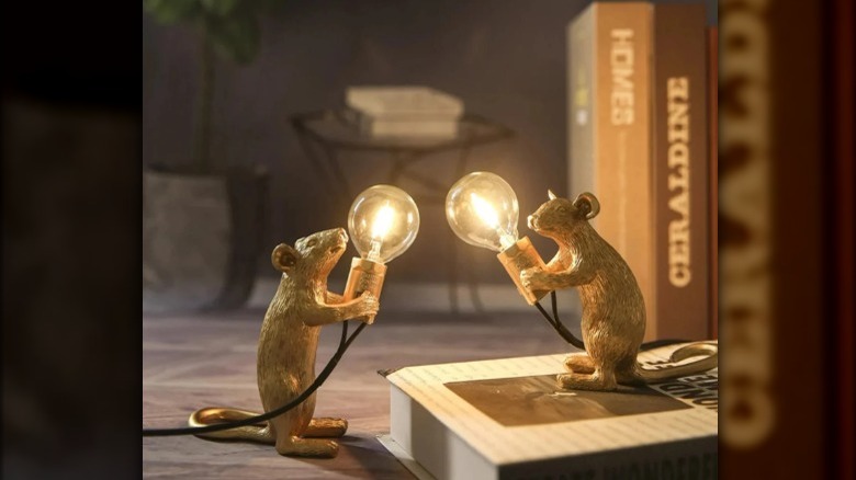 Golden mice holding bulbs