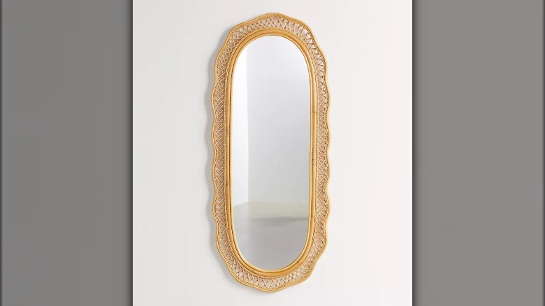 Curvy rattan wall mirror