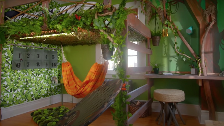 green bedroom with orange hammock