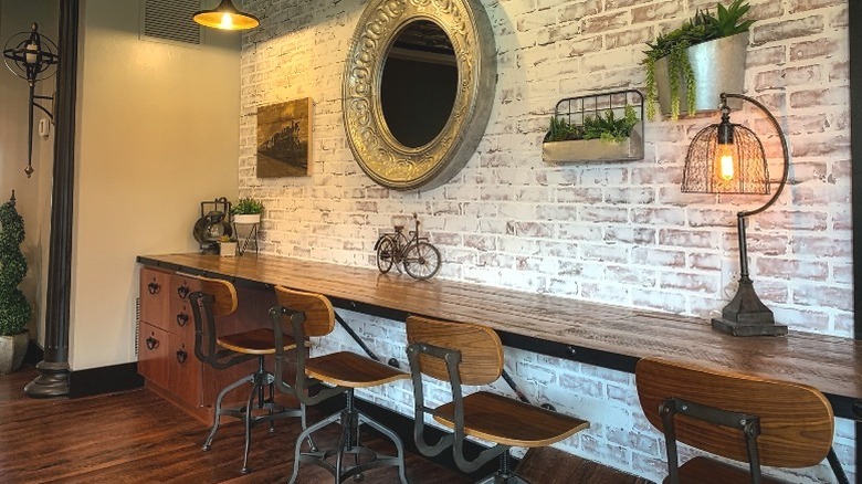 Bar table against brick wall