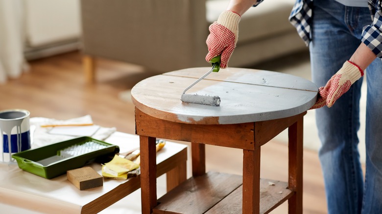 Person painting table