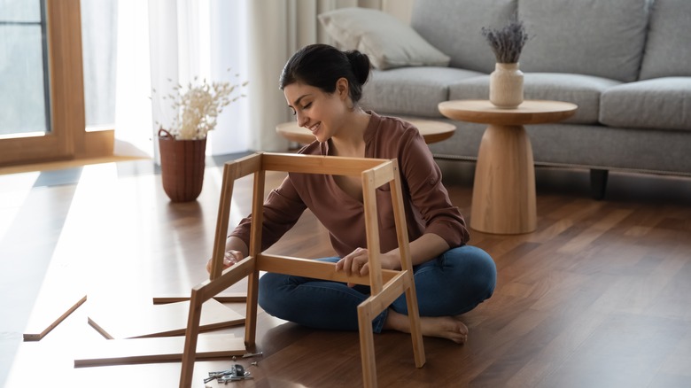 Person assembling furniture