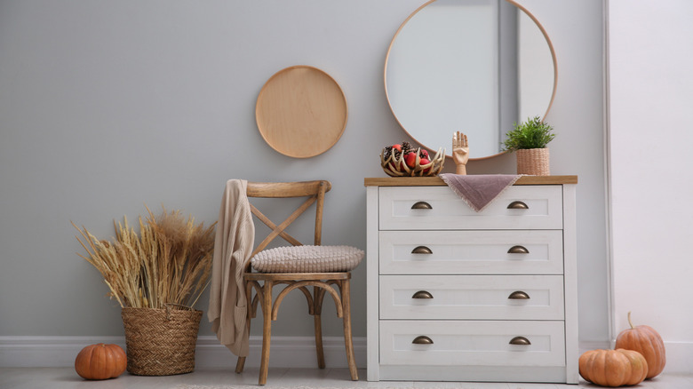 dresser beside a chair