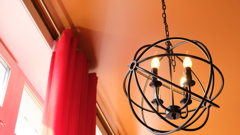 chandelier with orange ceiling