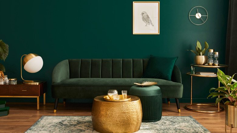 Gold décor with green couch