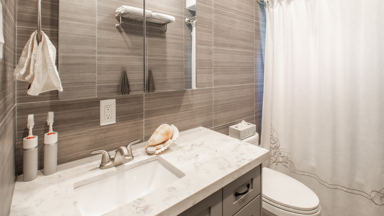 neutral bathroom with white curtain