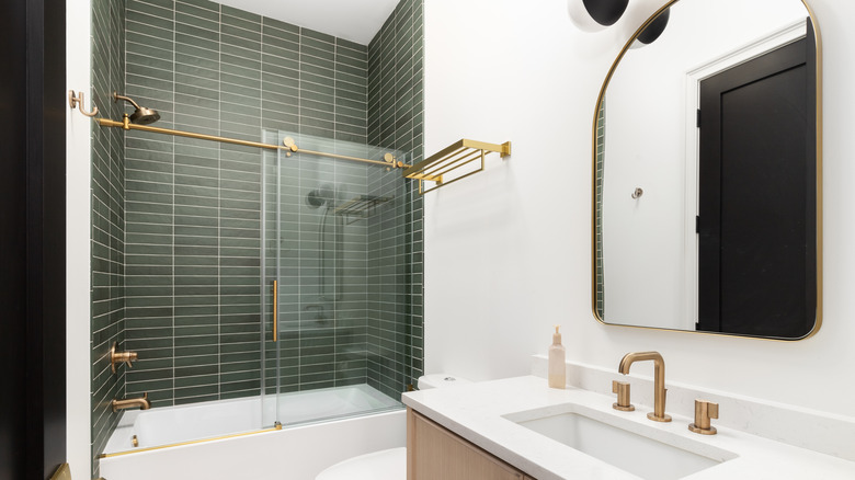 shower with stacked green tiles