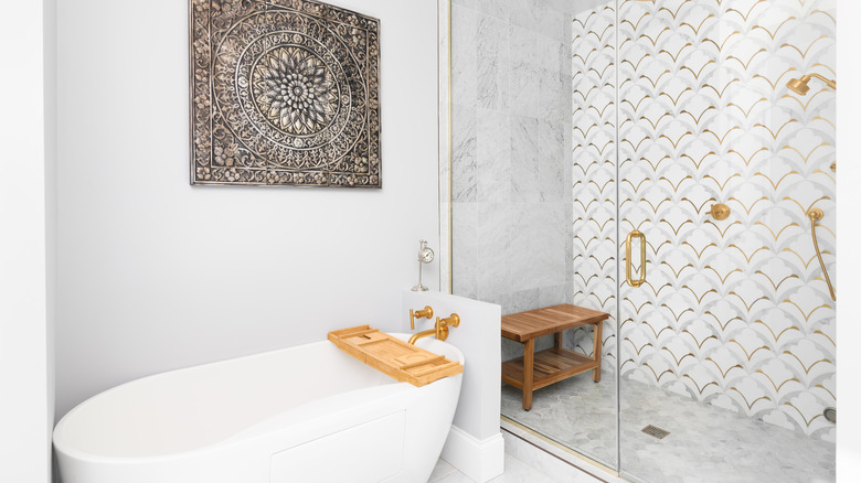 shower with gold accent wall