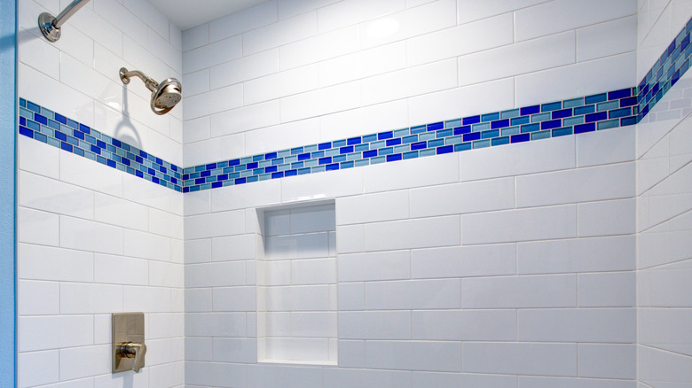 shower with strip of pattern tiles