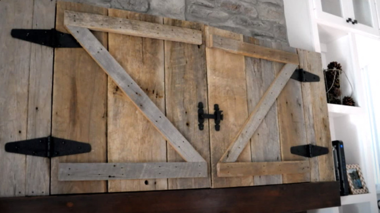 barn doors above fireplace