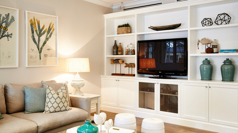 television inside white shelving unit