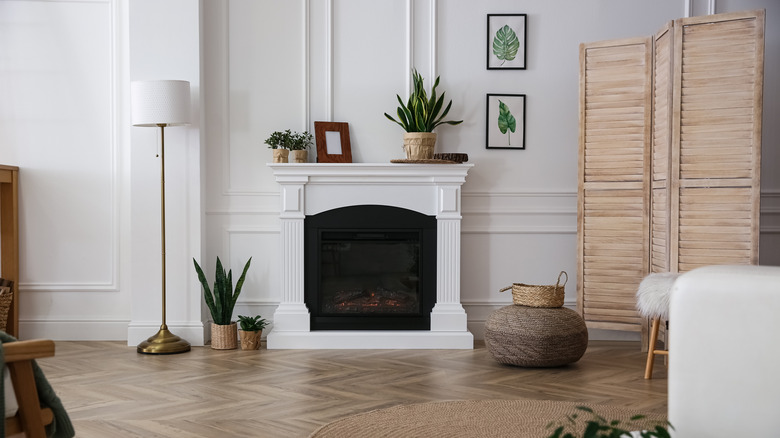 wooden folding screen near fireplace