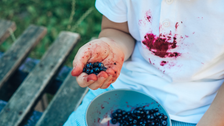 blueberries smeared on shirt