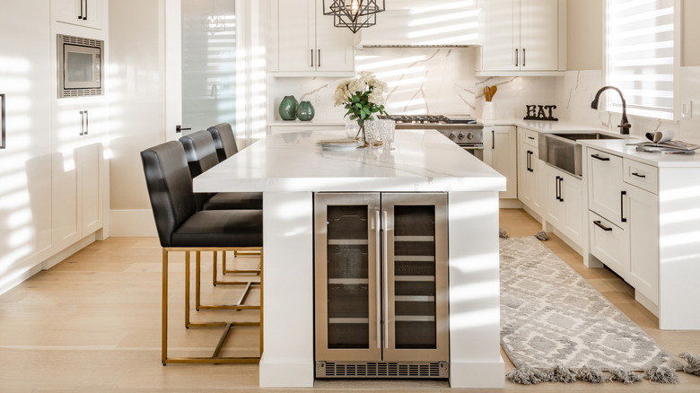 Kitchen island with a built-in mini fridge for drinks