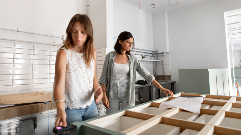 Two women designing their kitchen island