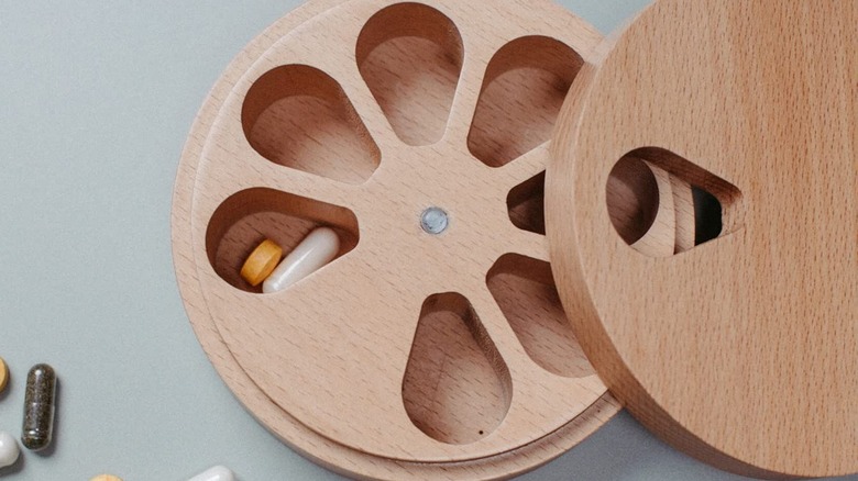 Wooden pill dispenser