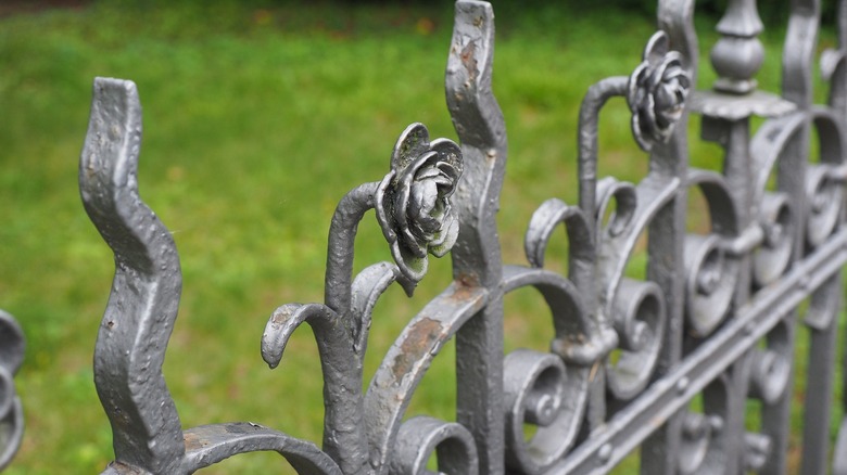 Rose ornament on wrought iron fence