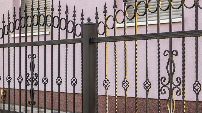 spearheaded wrought iron fence with basket designs