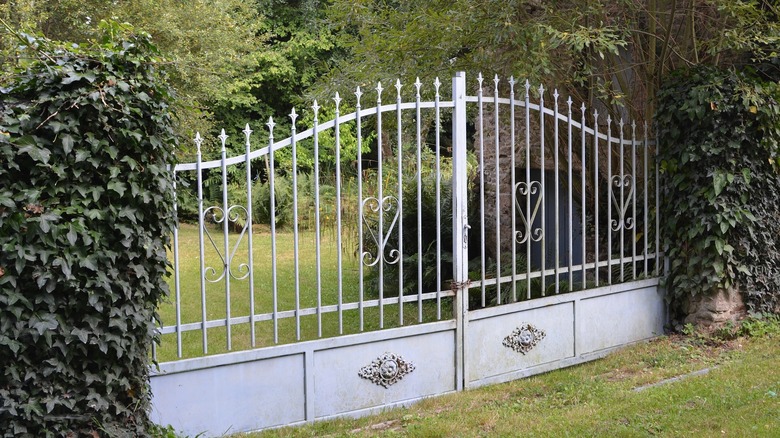 wrought iron gate painted gray blue